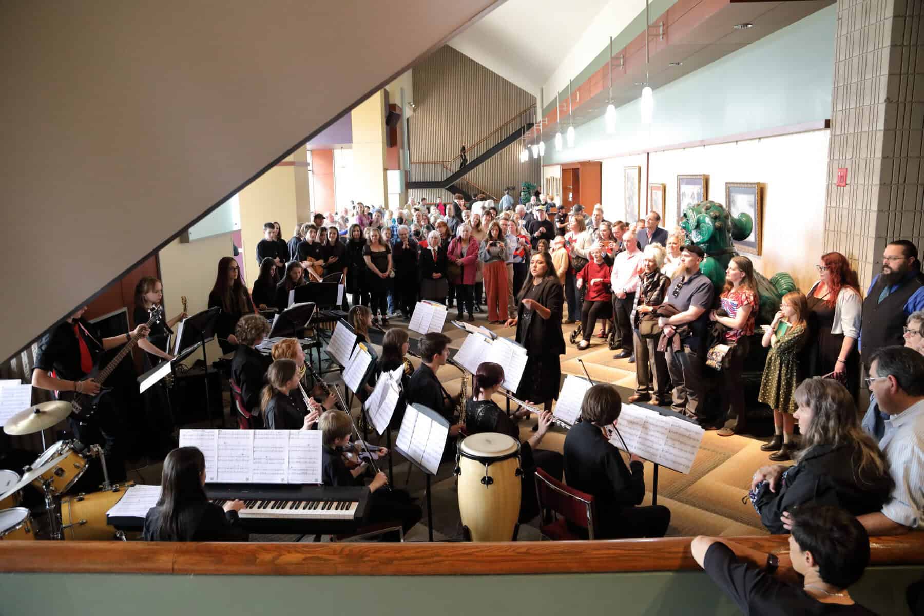 North Middle School Jazz Band playing the Mezzanine Lobby in front of a crowd at intermission.
